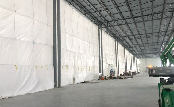 Weather and Heat Retention covering in use in a large warehouse