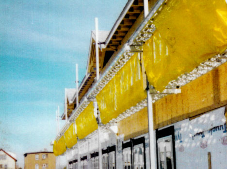 Pump Jack System of scaffolding in use on a construction site